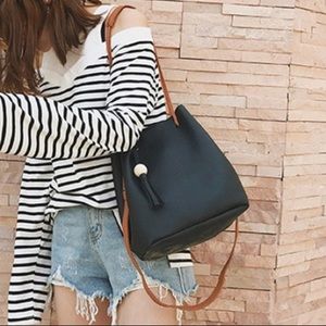 Black bag with tassel and accessories